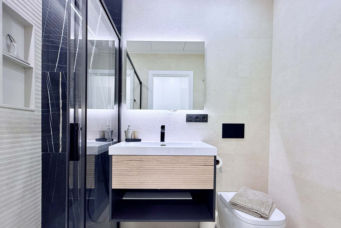 Contemporary bathroom in Mirador apartment with walk-in shower