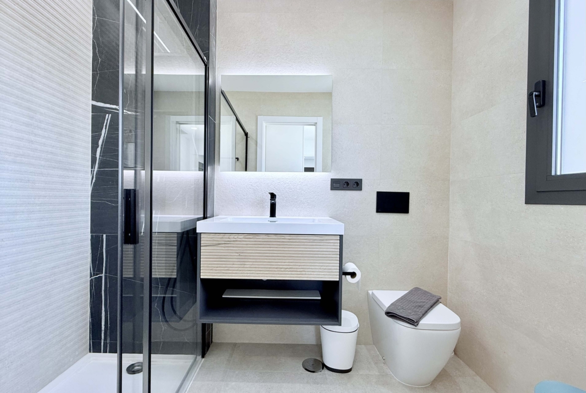 Contemporary bathroom in Mirador apartment with walk-in shower