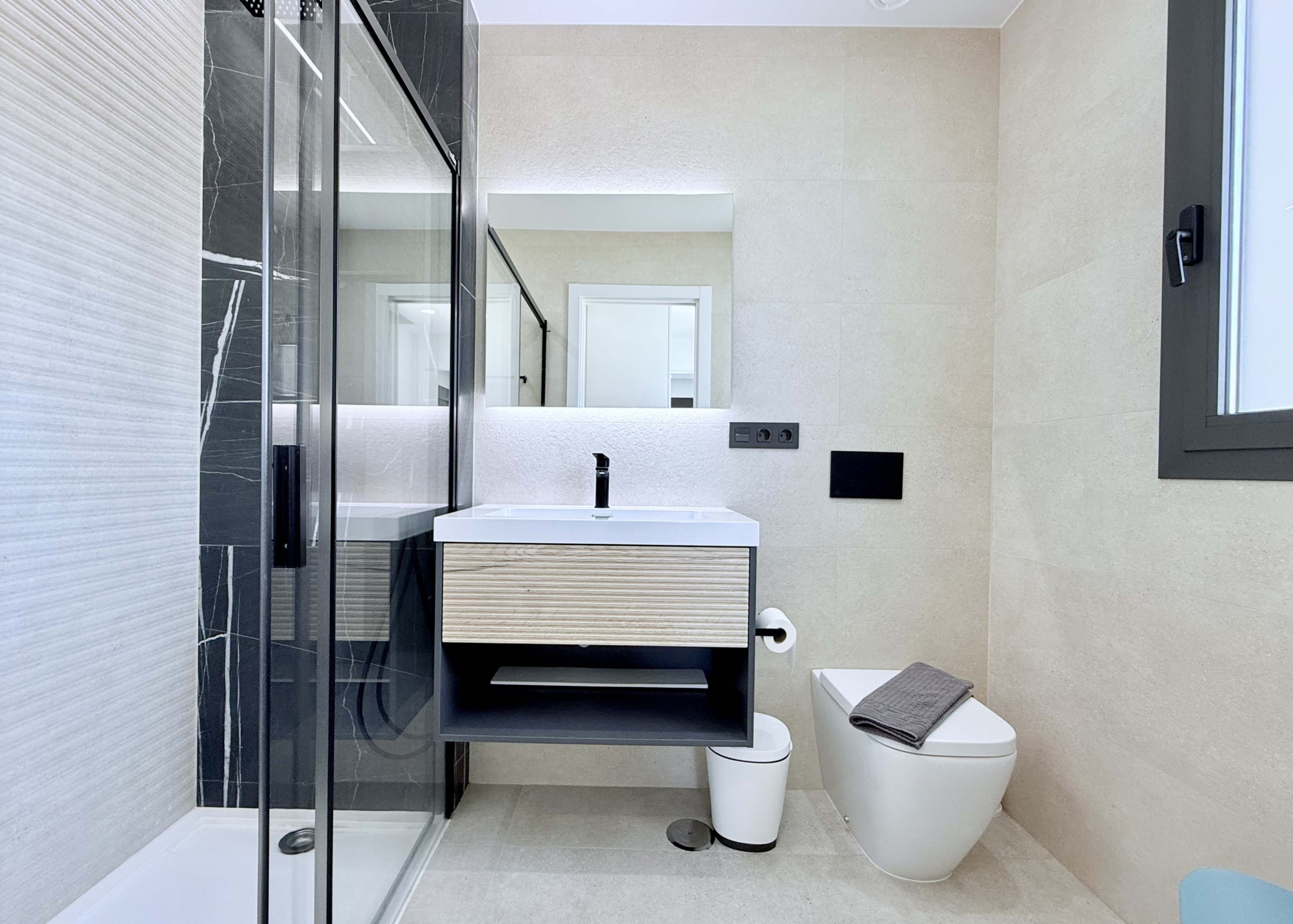 Contemporary bathroom in Mirador apartment with walk-in shower