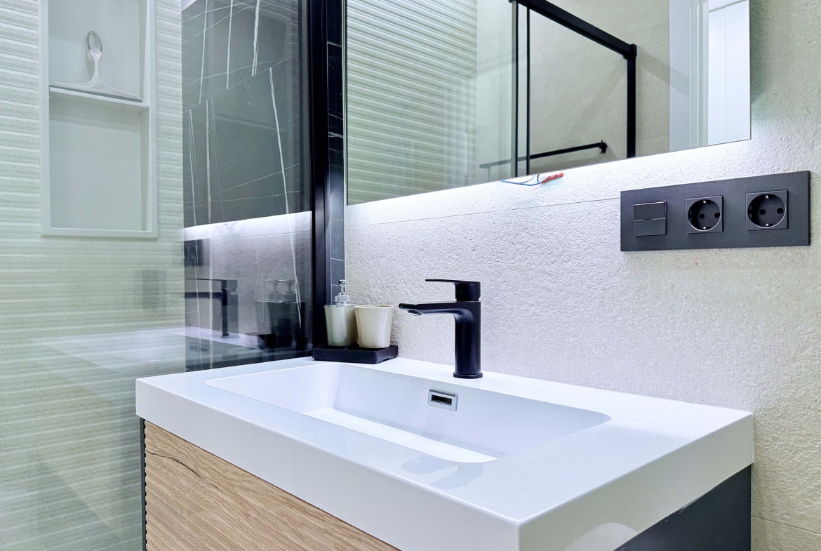 Contemporary bathroom in Mirador apartment with walk-in shower