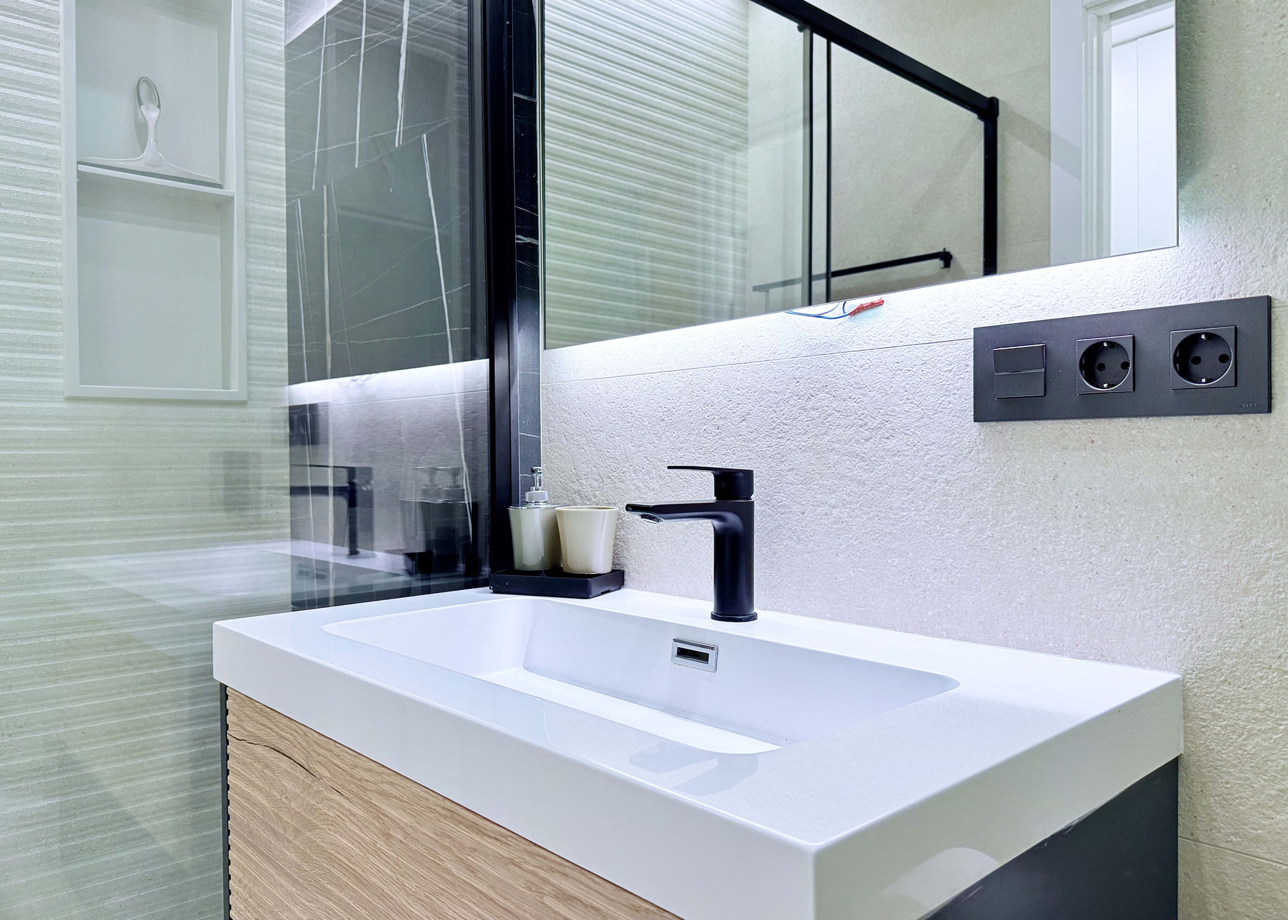 Contemporary bathroom in Mirador apartment with walk-in shower