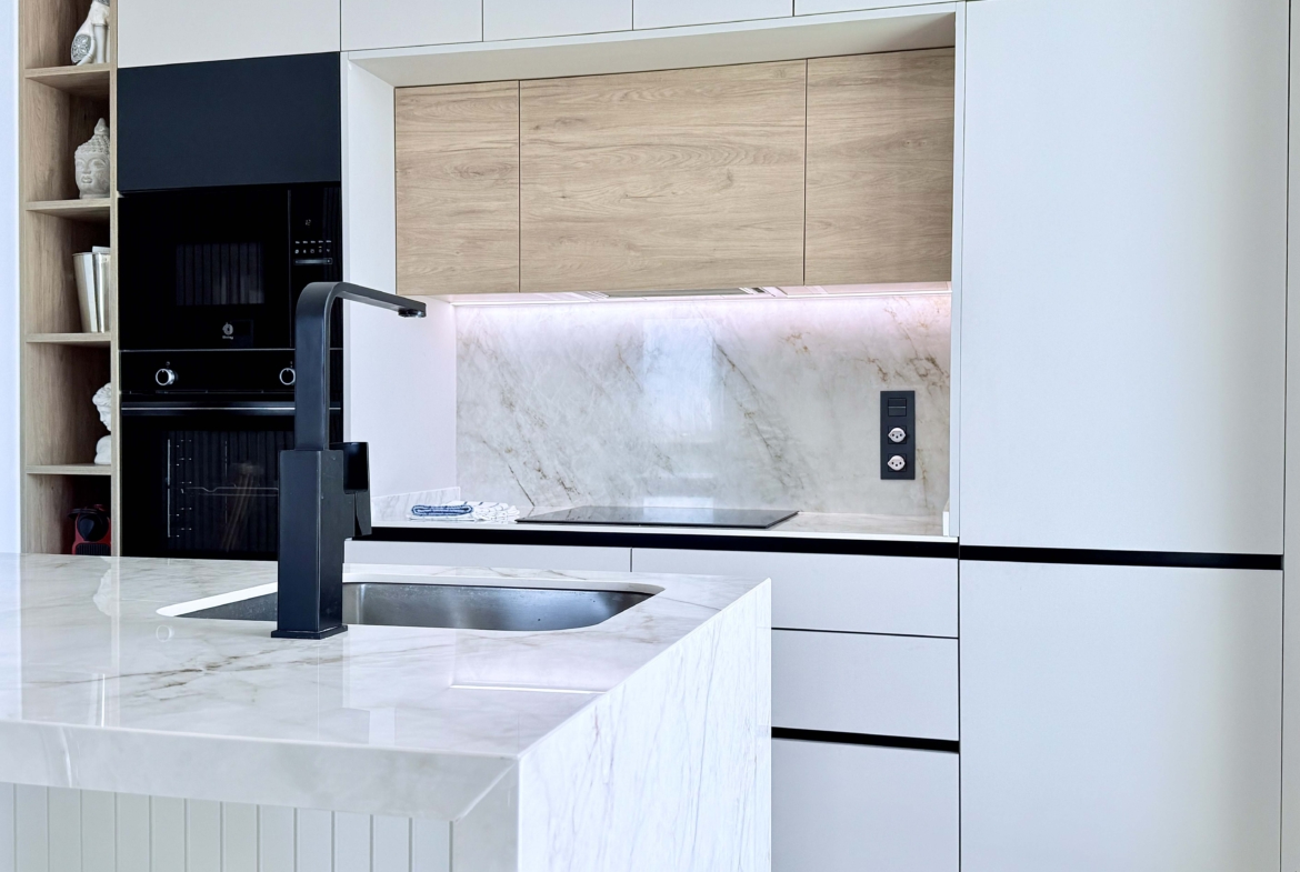 Modern kitchen with island in Mirador apartment