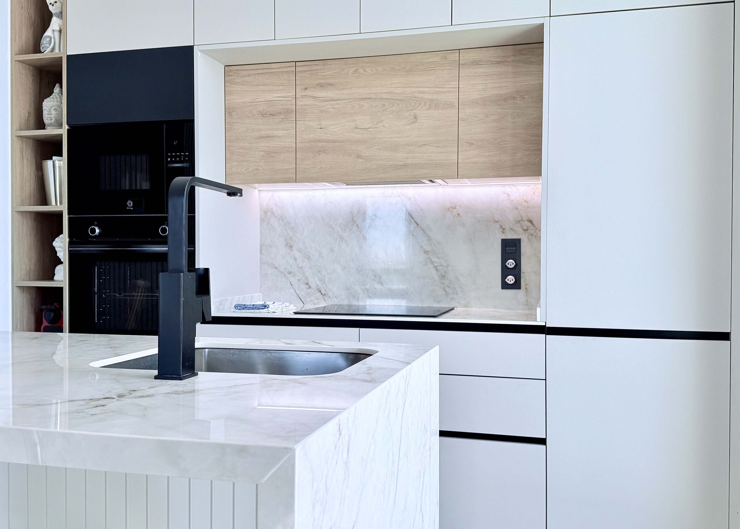 Modern kitchen with island in Mirador apartment
