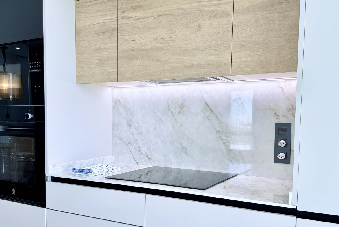 Modern kitchen with island in Mirador apartment