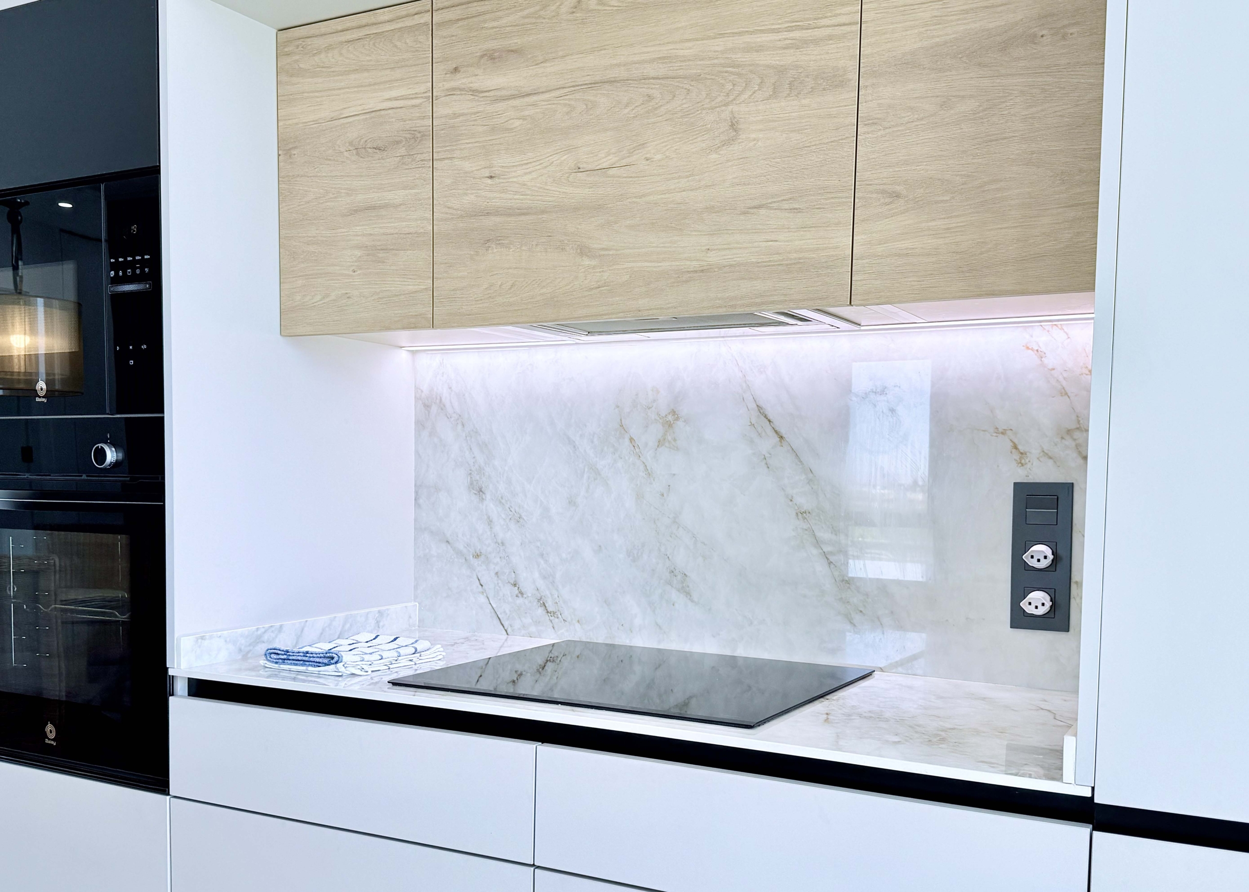 Modern kitchen with island in Mirador apartment