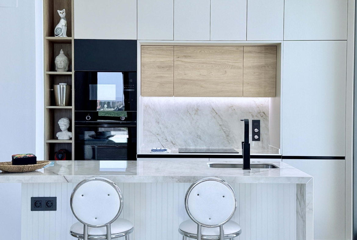 Modern kitchen with island in Mirador apartment