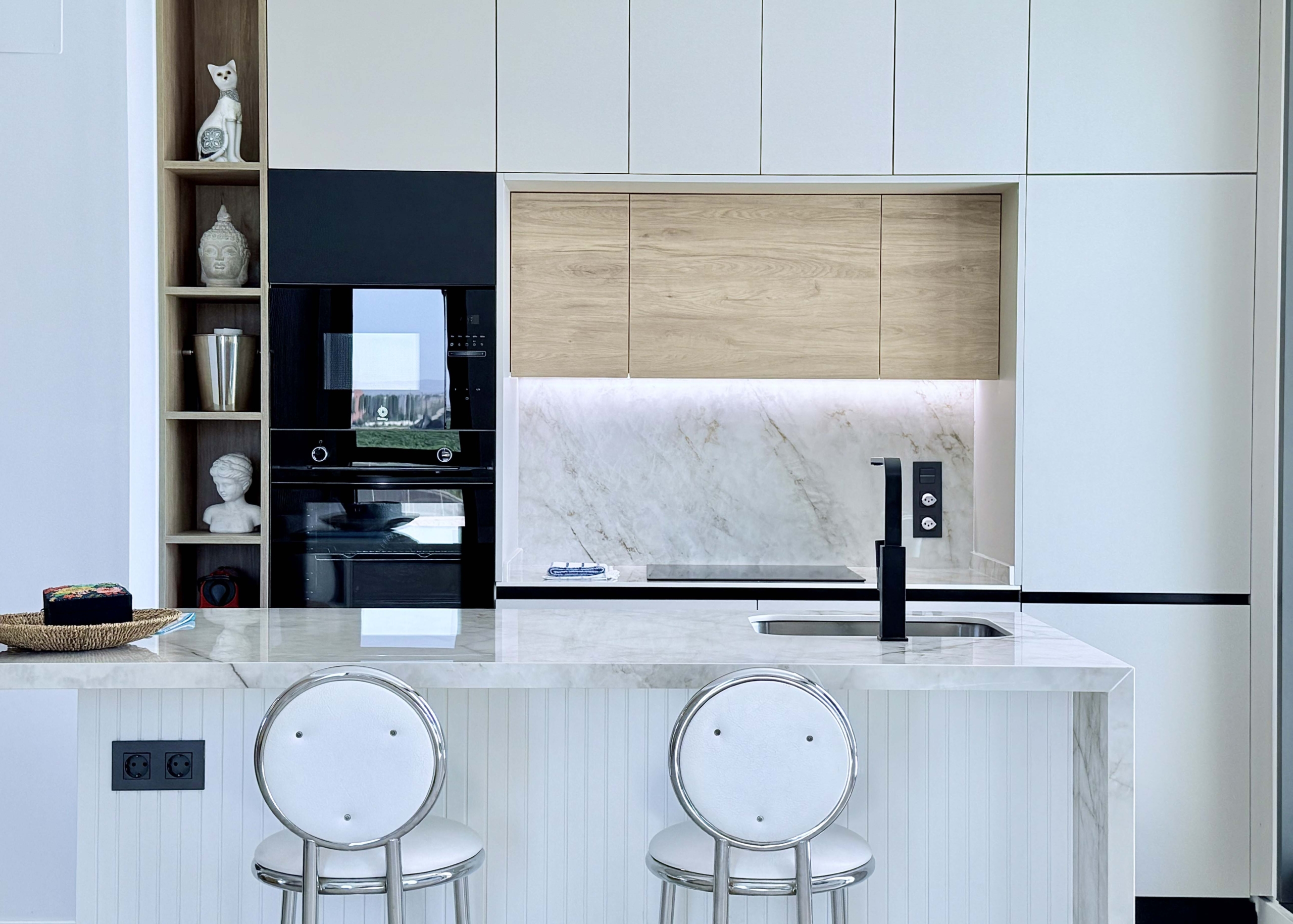 Modern kitchen with island in Mirador apartment
