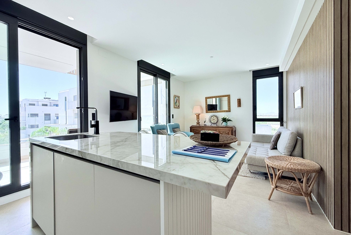 Modern kitchen with island in Mirador apartment