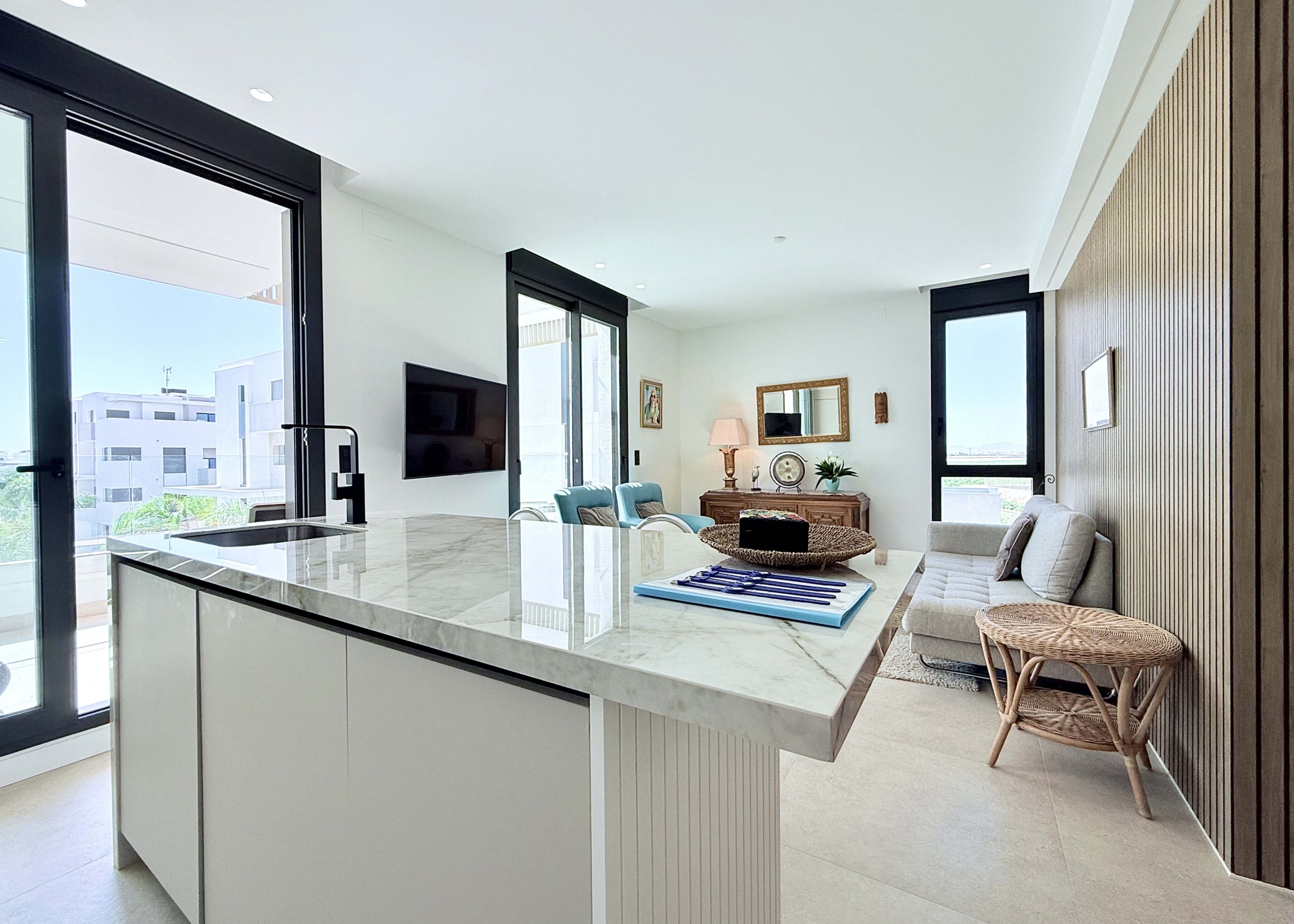 Modern kitchen with island in Mirador apartment