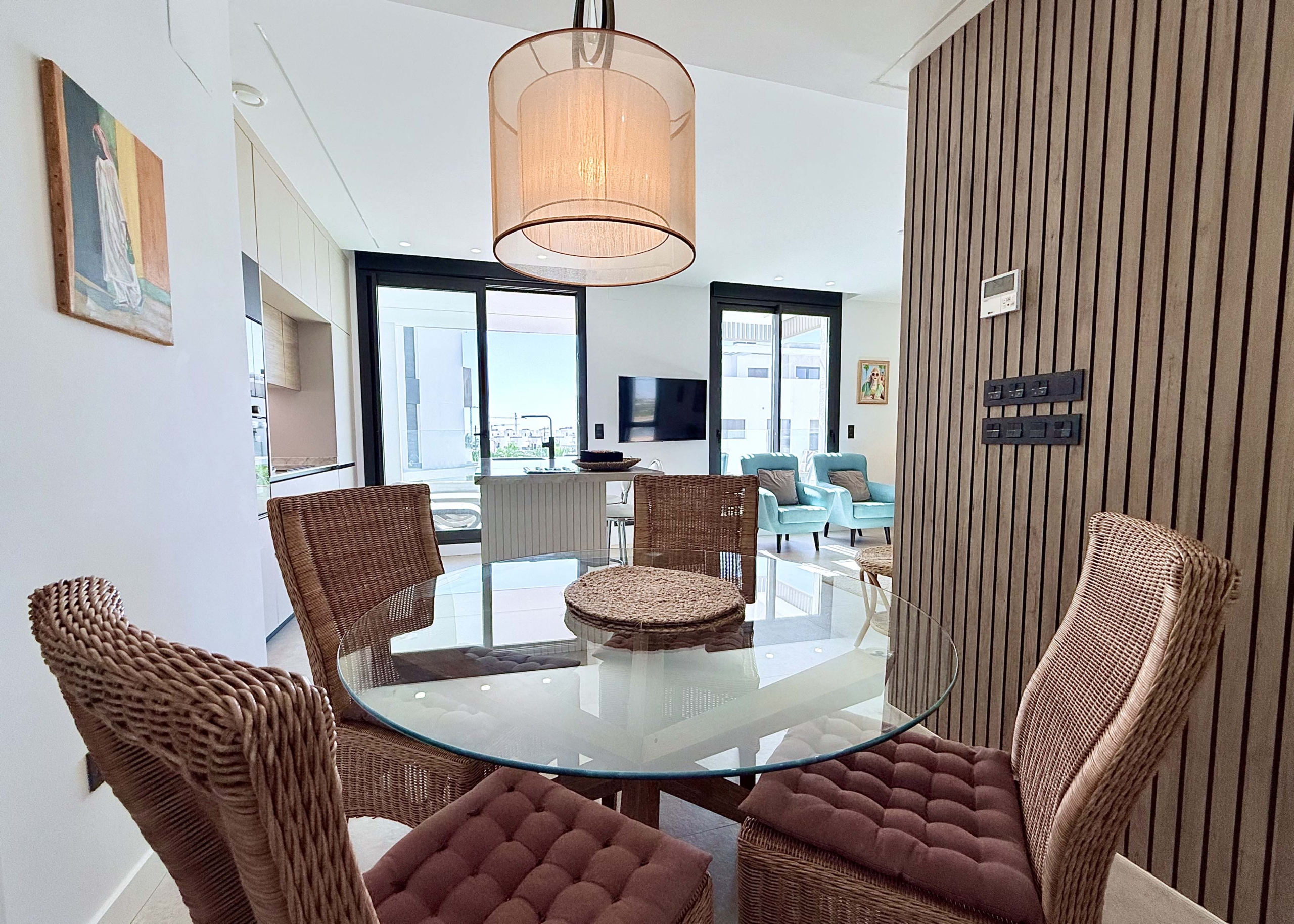 Open-plan living room inside Mirador apartment with terrace access