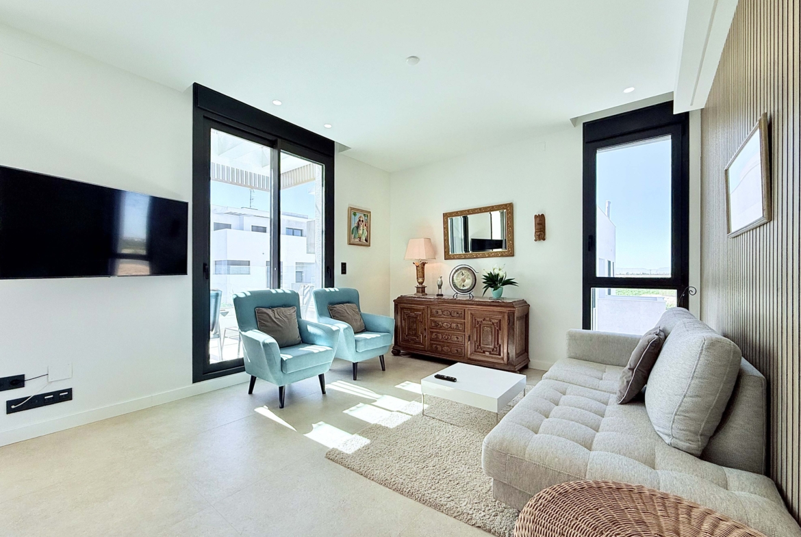 Open-plan living room inside Mirador apartment with terrace access