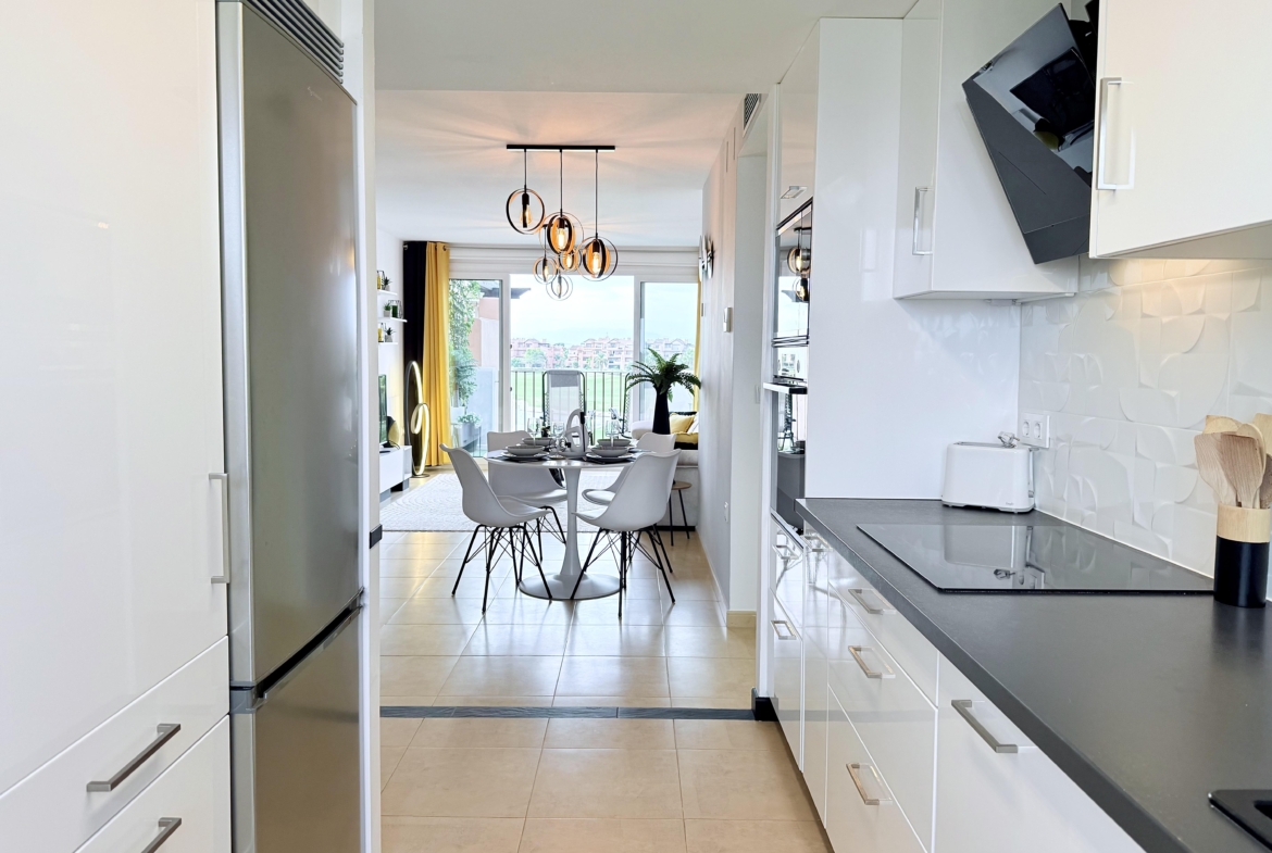 Modern open-plan kitchen in Mar Menor Golf Resort penthouse with Bosch appliances