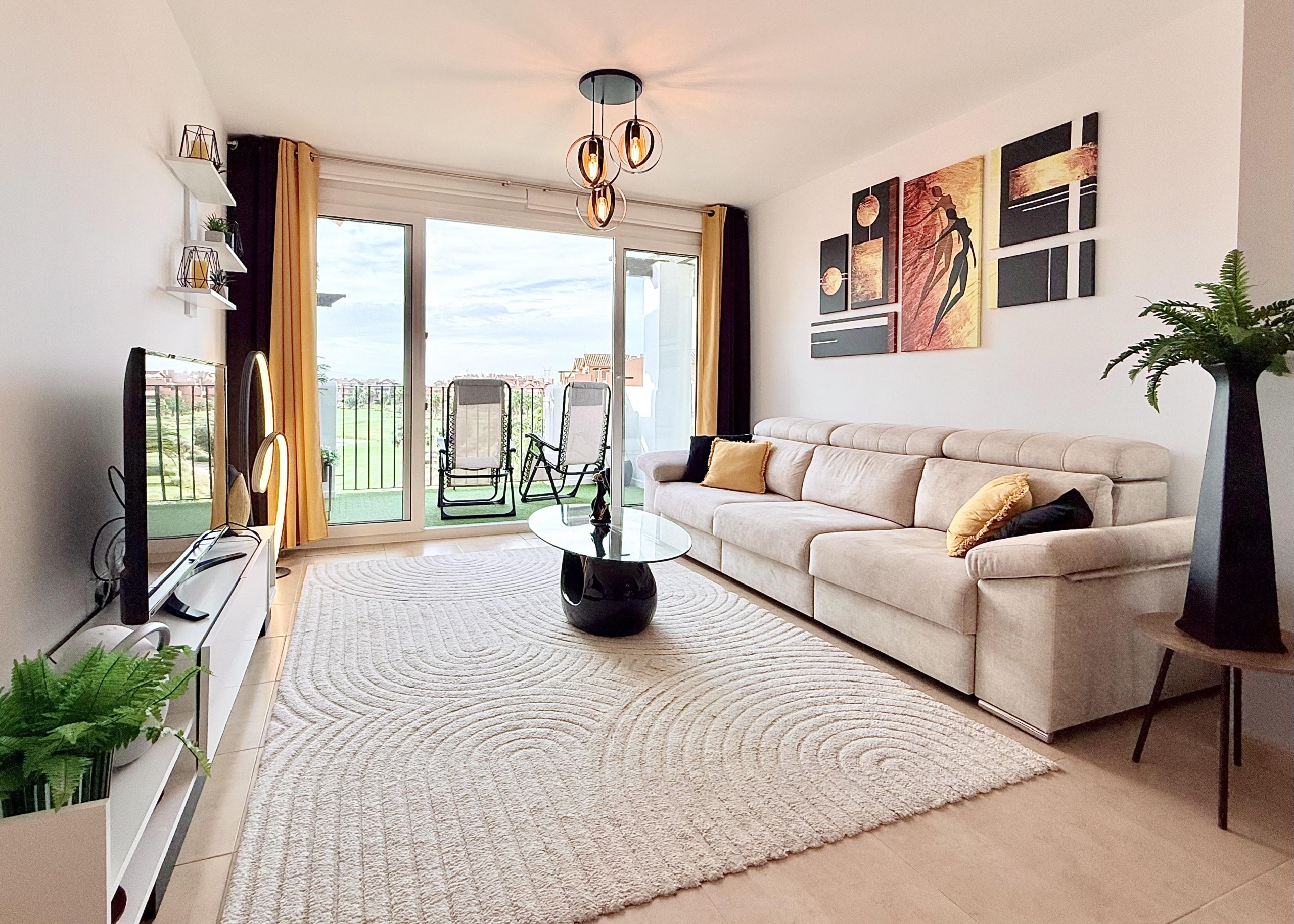 Contemporary living room in Mar Menor Golf Resort penthouse with terrace access