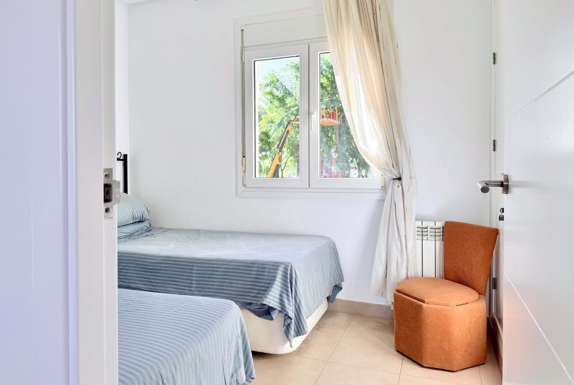 Spacious upstairs bedroom with built-in wardrobes at the Isla Grosa villa on Mar Menor Golf Resort.