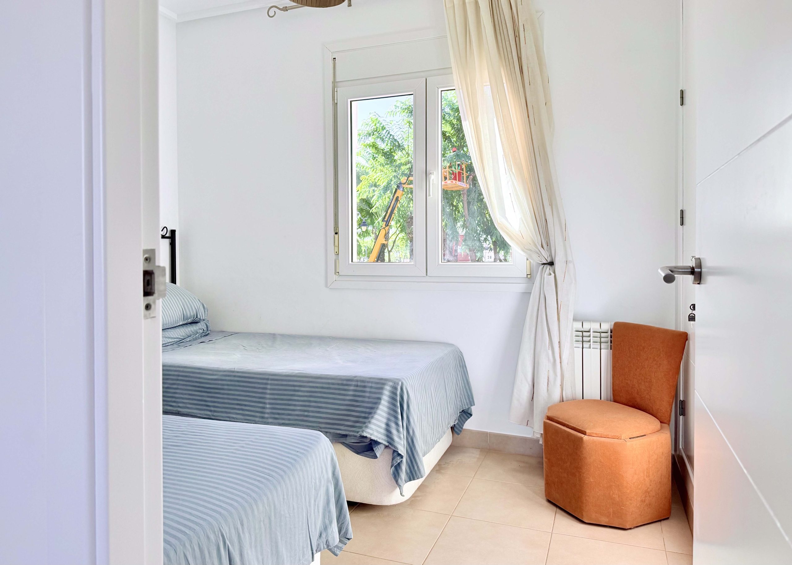 Spacious upstairs bedroom with built-in wardrobes at the Isla Grosa villa on Mar Menor Golf Resort.
