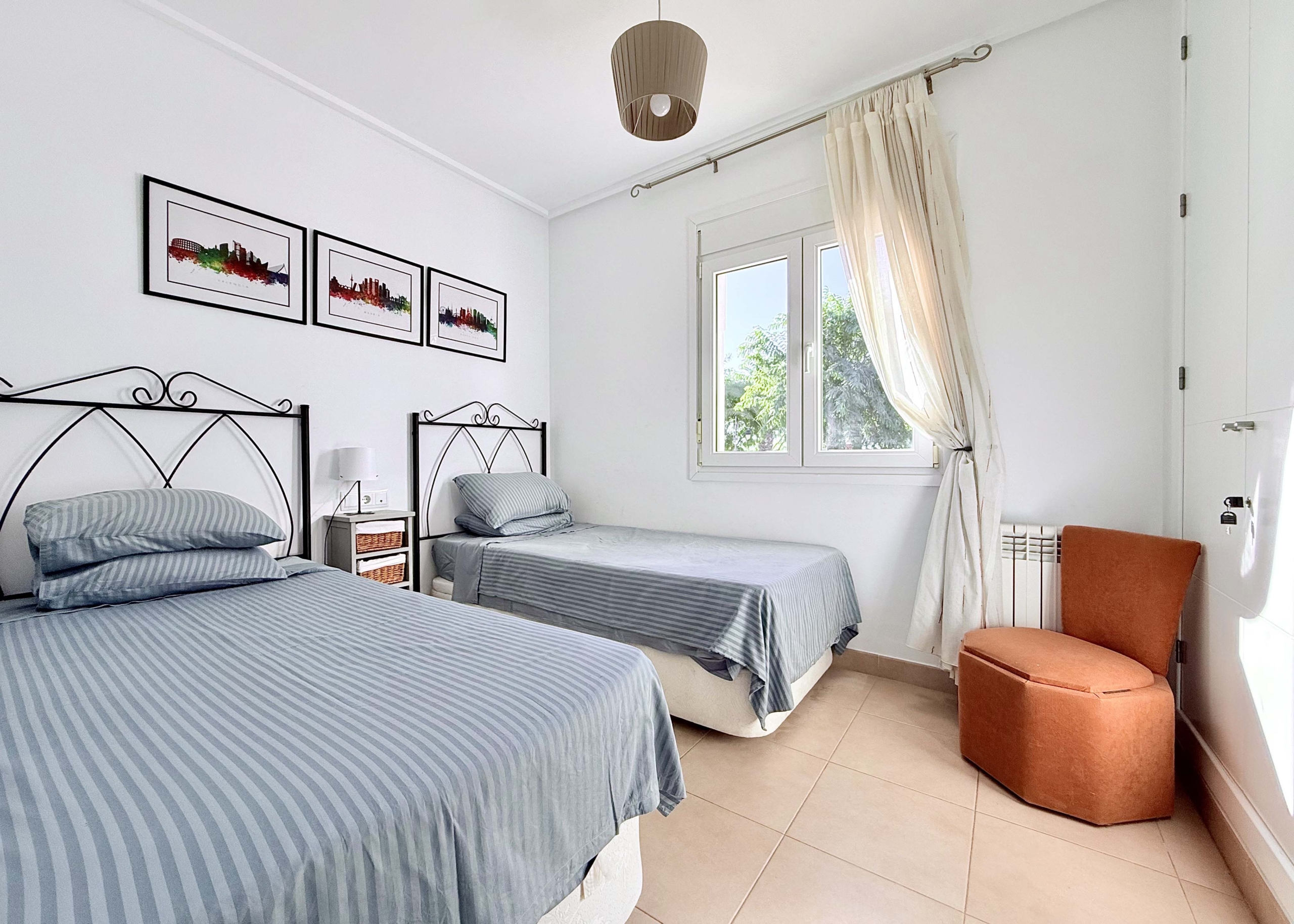 Spacious upstairs bedroom with built-in wardrobes at the Isla Grosa villa on Mar Menor Golf Resort