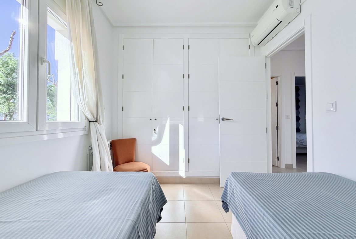 Spacious upstairs bedroom with built-in wardrobes at the Isla Grosa villa on Mar Menor Golf Resort.