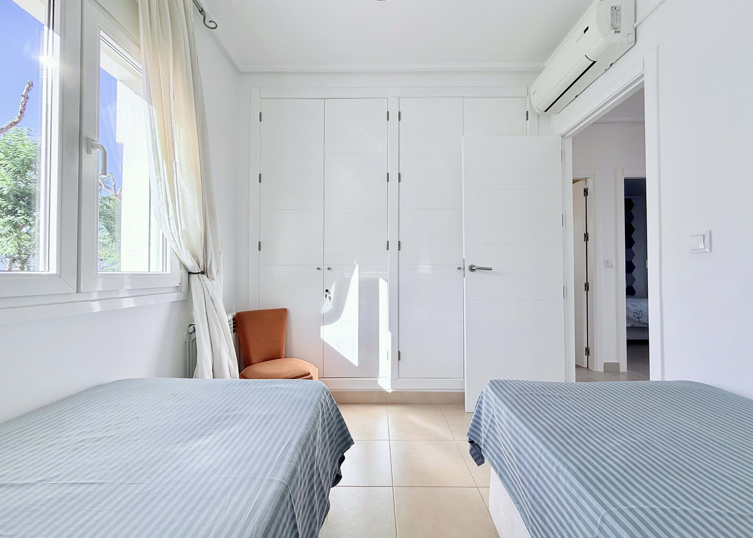 Spacious upstairs bedroom with built-in wardrobes at the Isla Grosa villa on Mar Menor Golf Resort.