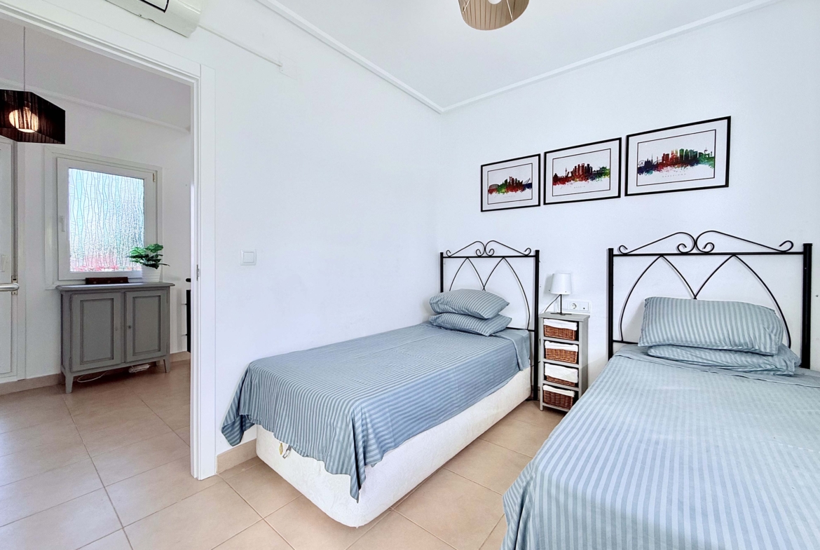 Spacious upstairs bedroom with built-in wardrobes at the Isla Grosa villa on Mar Menor Golf Resort.