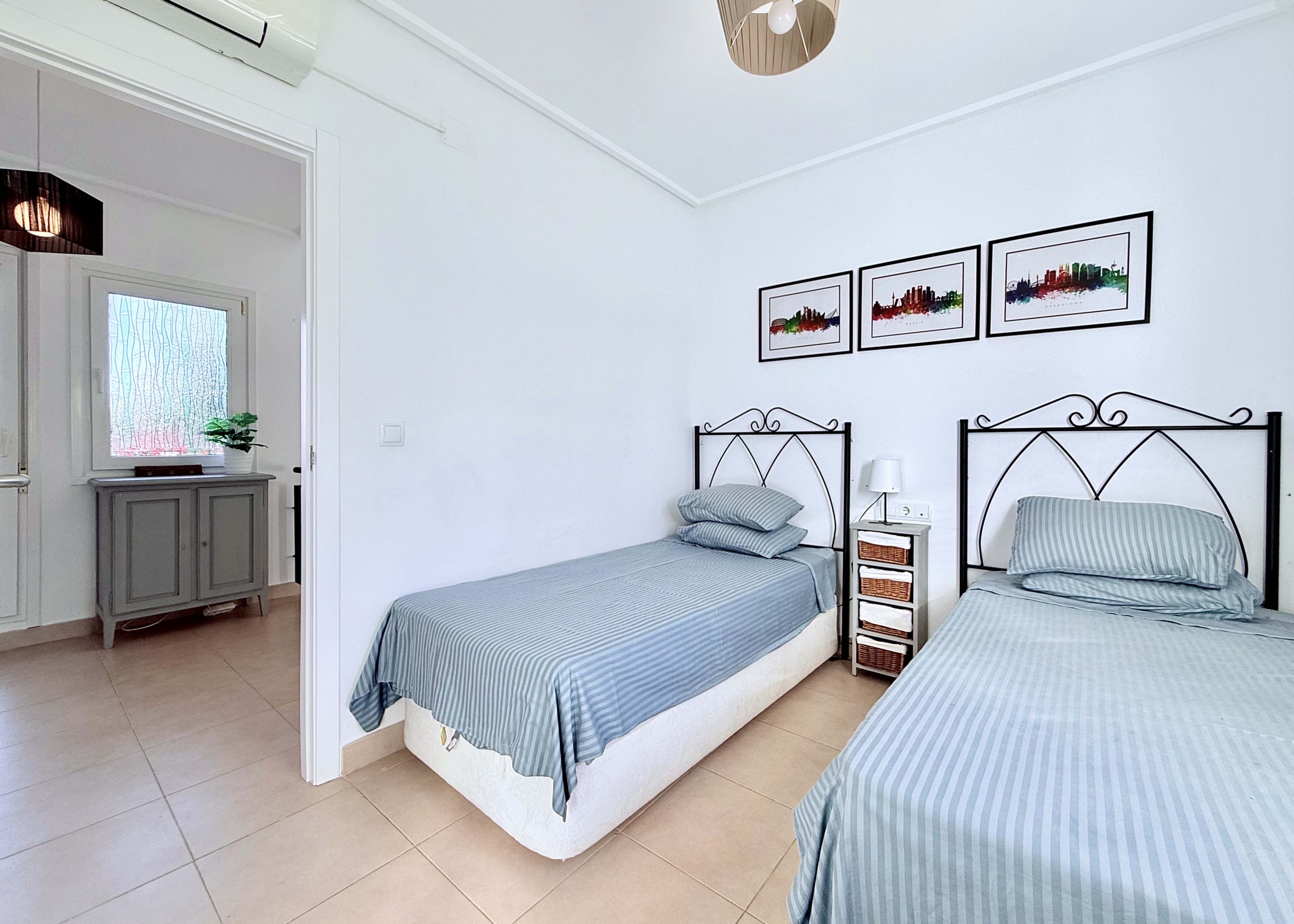 Spacious upstairs bedroom with built-in wardrobes at the Isla Grosa villa on Mar Menor Golf Resort.