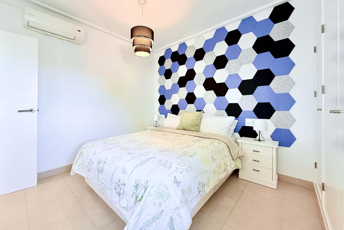 Spacious upstairs bedroom with built-in wardrobes at the Isla Grosa villa on Mar Menor Golf Resort.
