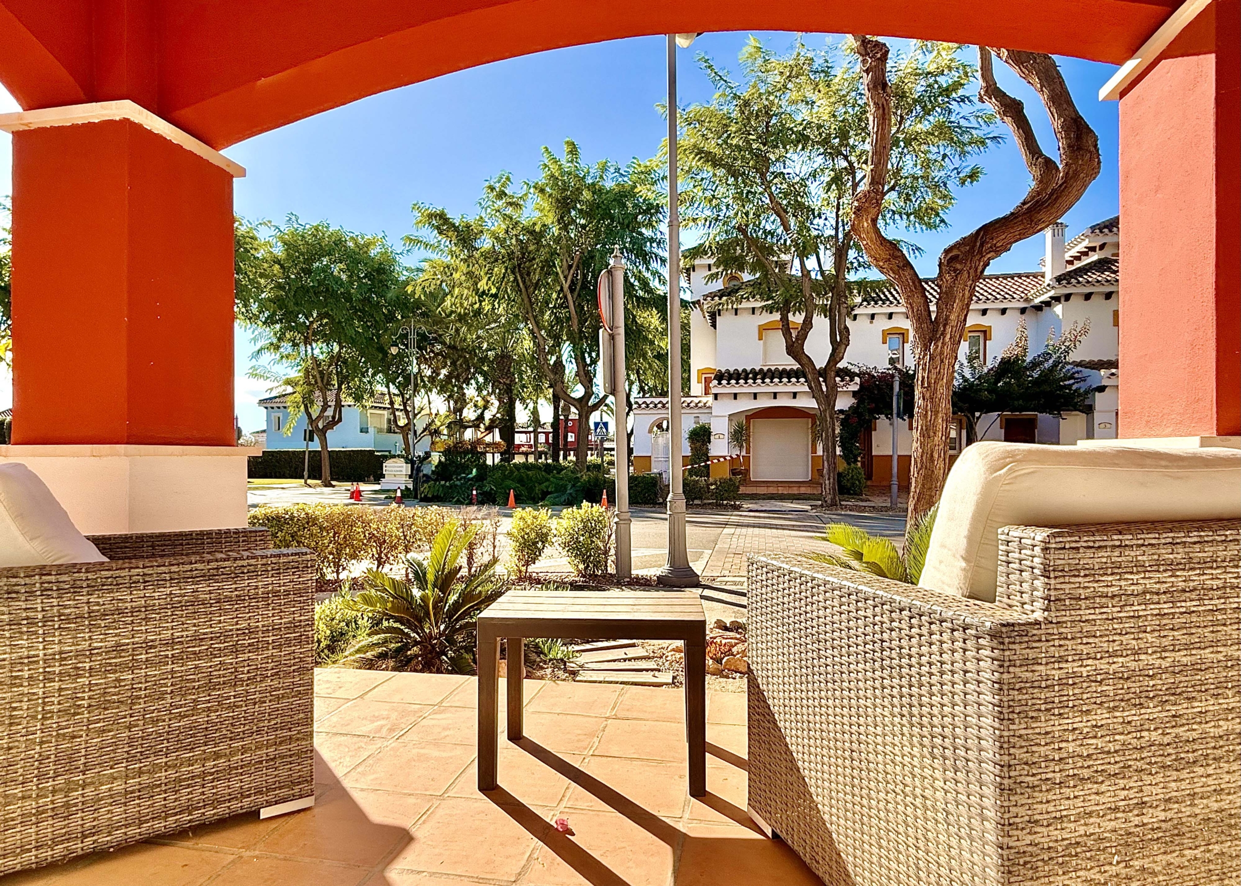 Front covered terrace with morning sun at the Isla Grosa villa on Mar Menor Golf Resort.