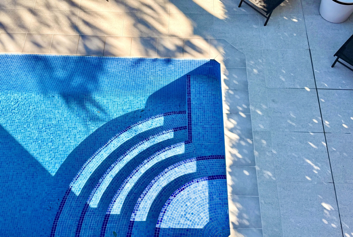 Heated private pool and modern tiled garden at the Isla Grosa villa on Mar Menor Golf Resort.