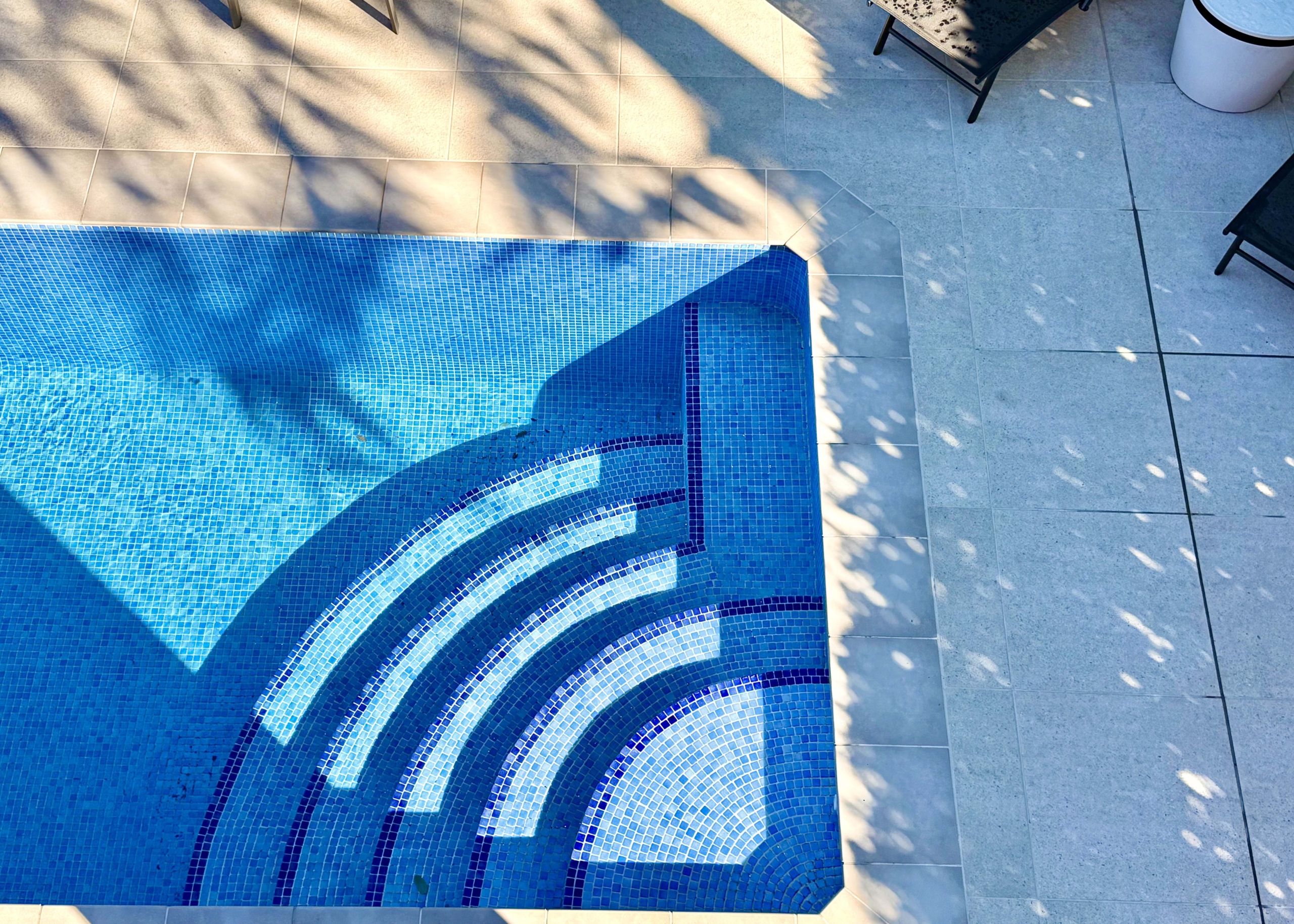 Heated private pool and modern tiled garden at the Isla Grosa villa on Mar Menor Golf Resort.