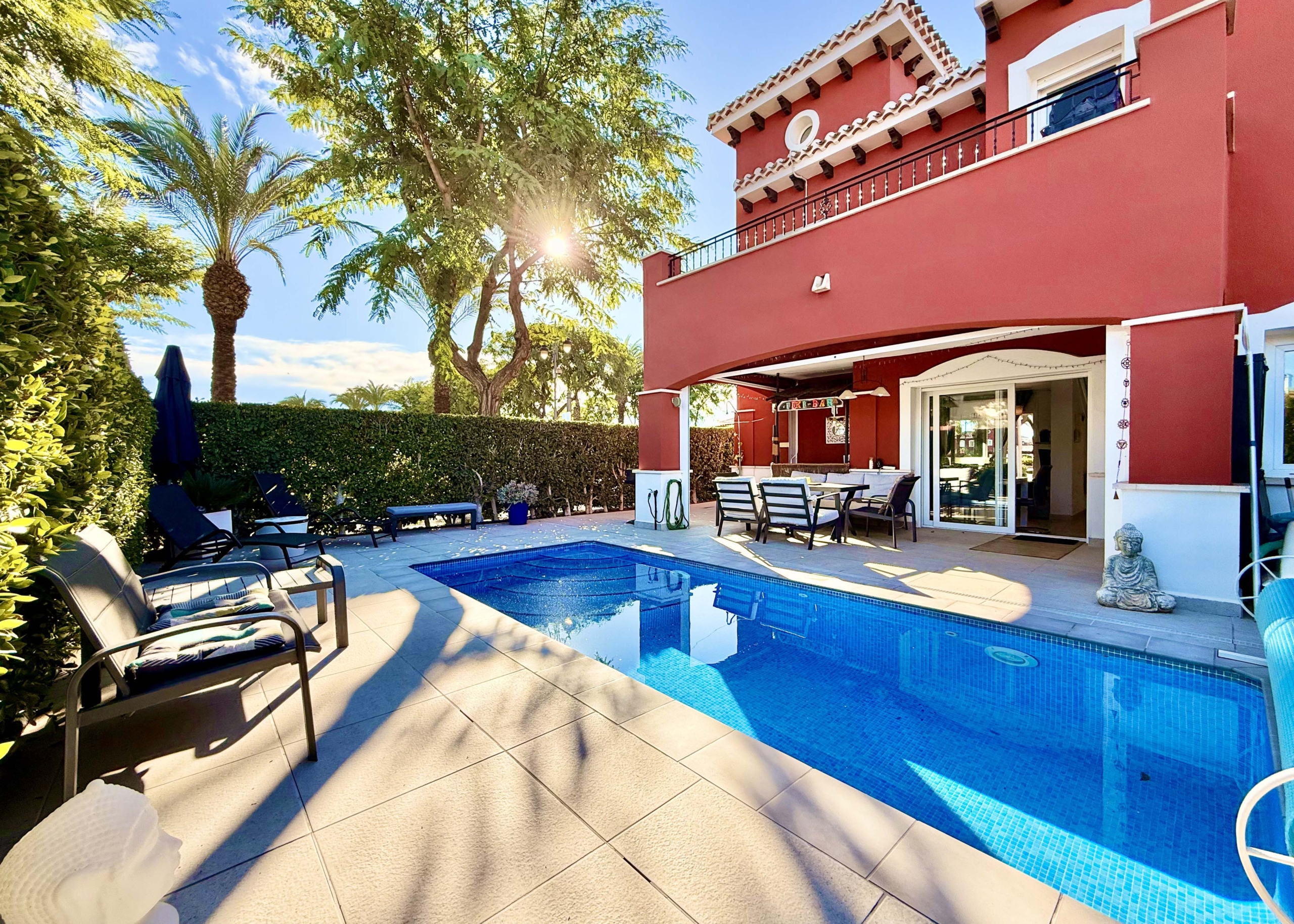 Heated private pool and modern tiled garden at the Isla Grosa villa on Mar Menor Golf Resort.
