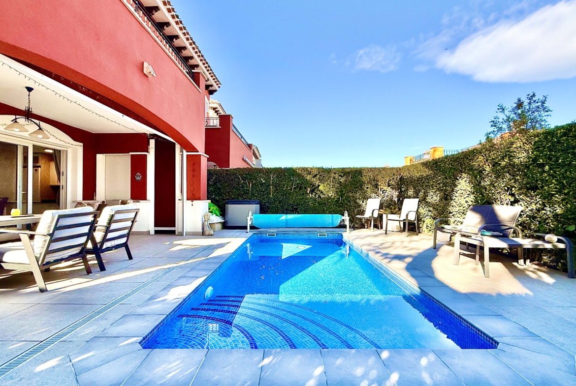 Heated private pool and modern tiled garden at the Isla Grosa villa on Mar Menor Golf Resort.