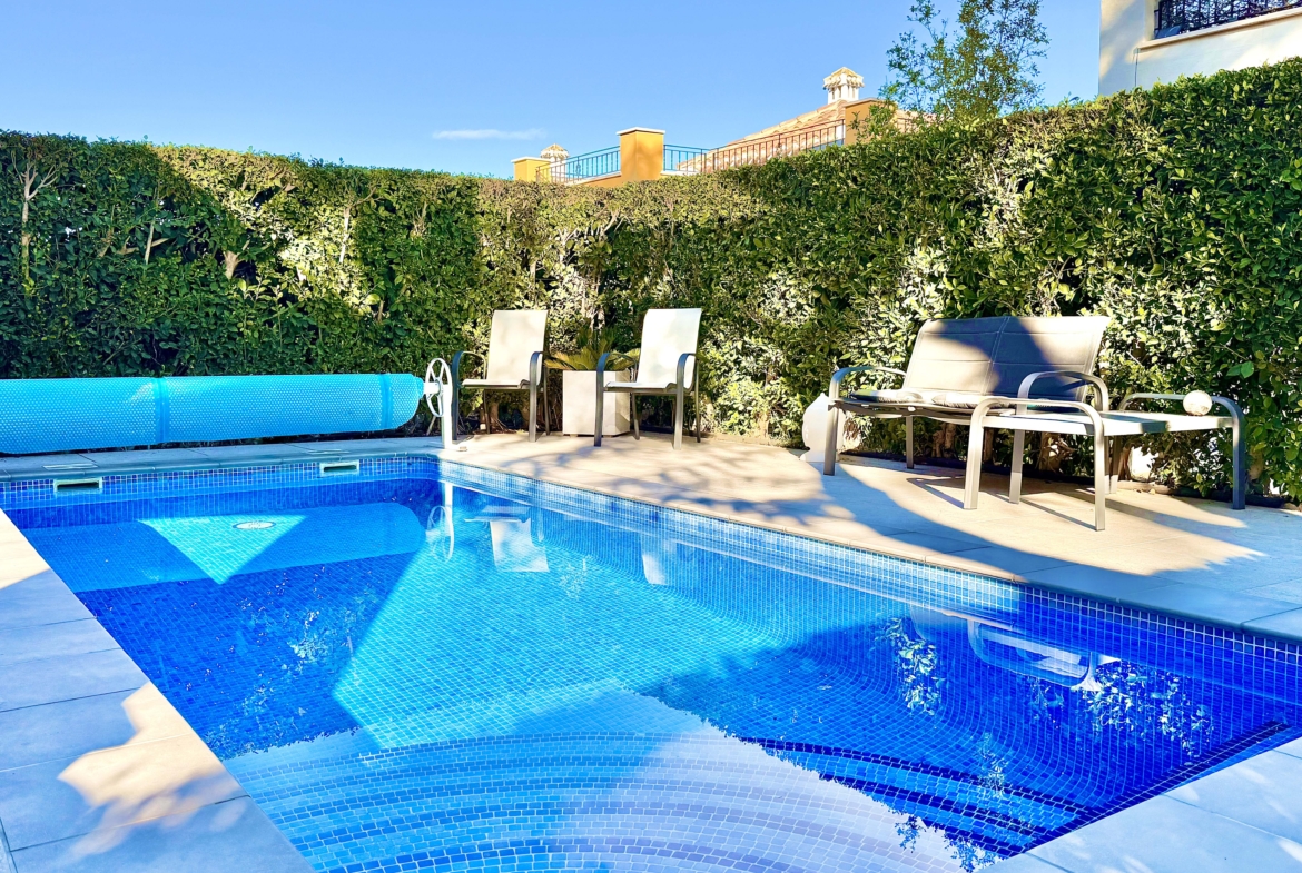 Heated private pool and modern tiled garden at the Isla Grosa villa on Mar Menor Golf Resort.