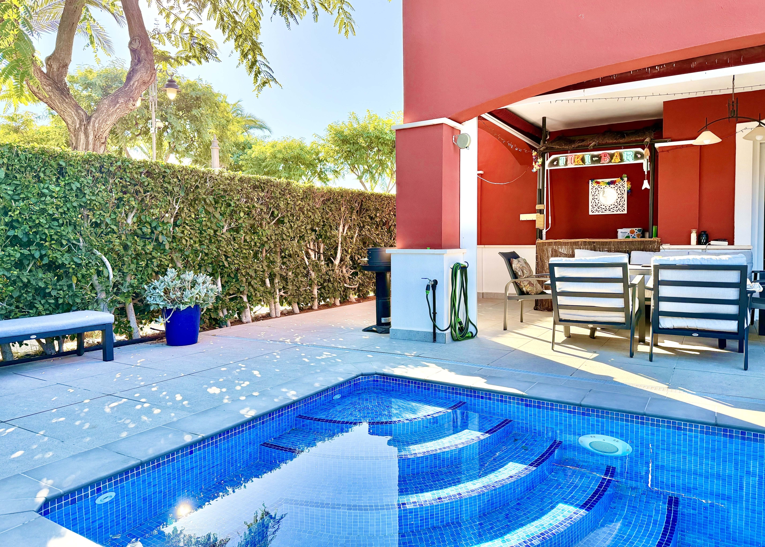 Heated private pool and modern tiled garden at the Isla Grosa villa on Mar Menor Golf Resort.