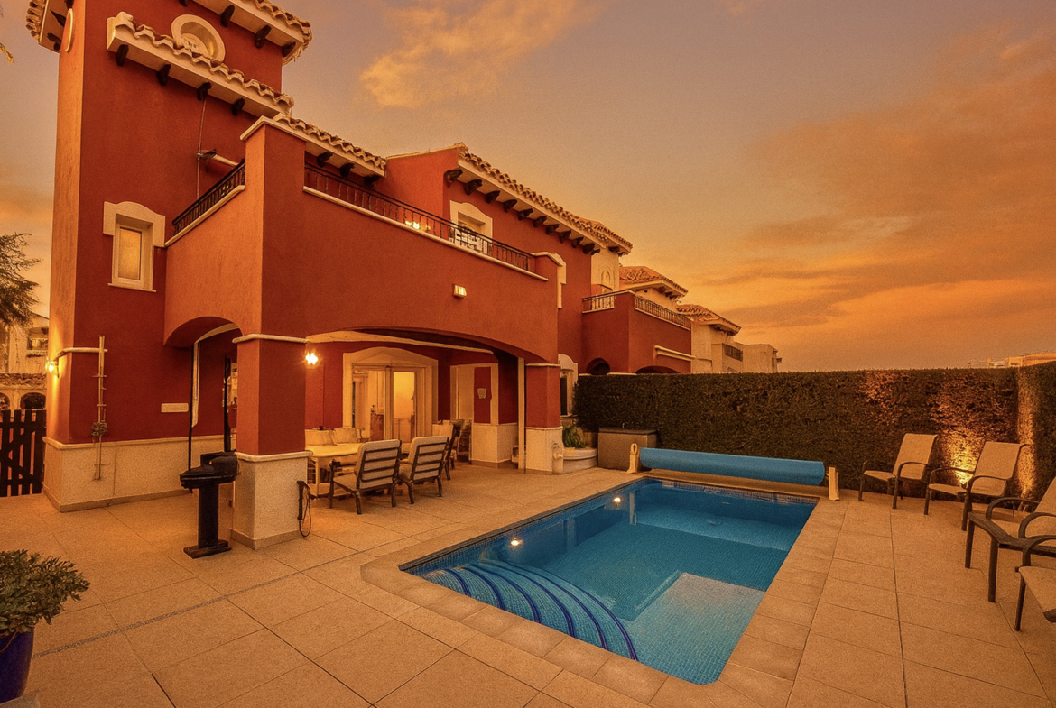 Heated private pool and modern tiled garden at the Isla Grosa villa on Mar Menor Golf Resort.