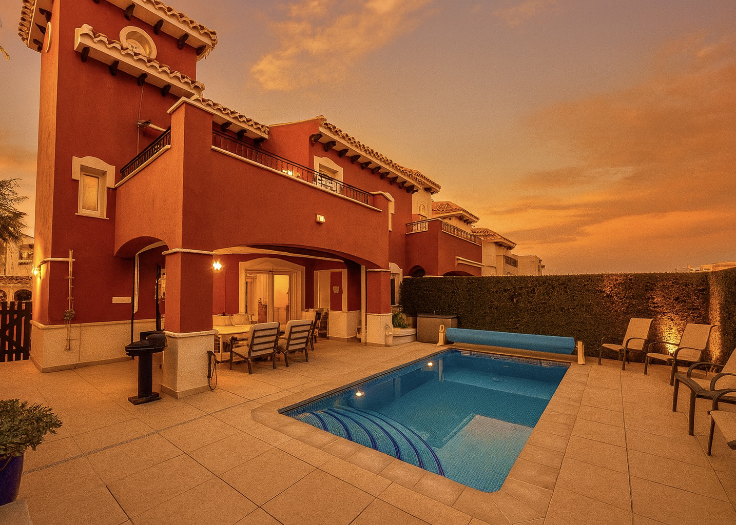 Heated private pool and modern tiled garden at the Isla Grosa villa on Mar Menor Golf Resort.