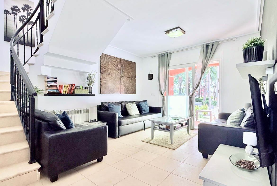 Open-plan living and dining area with terrace access at the Isla Grosa villa on Mar Menor Golf Resort.