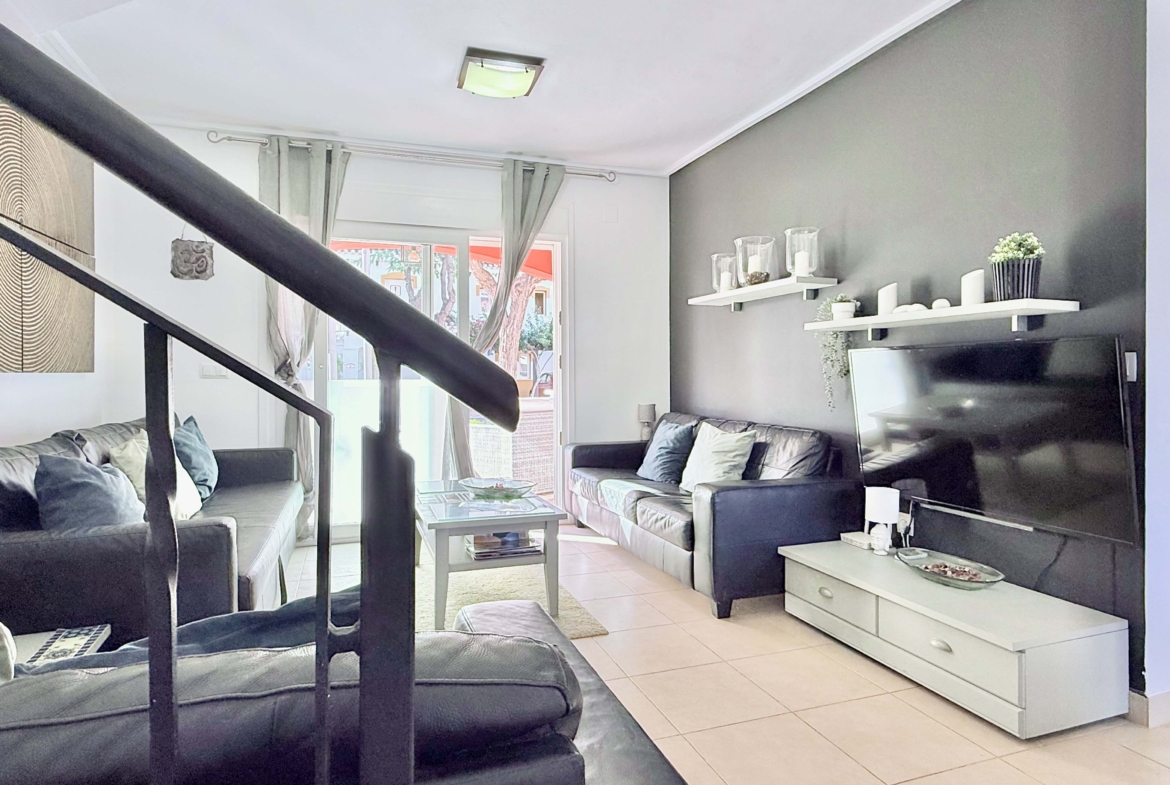 Open-plan living and dining area with terrace access at the Isla Grosa villa on Mar Menor Golf Resort.