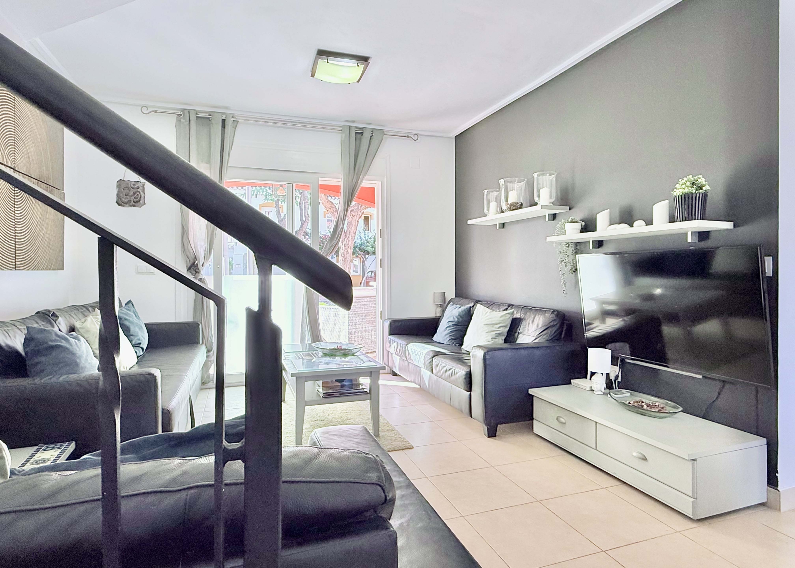 Open-plan living and dining area with terrace access at the Isla Grosa villa on Mar Menor Golf Resort.