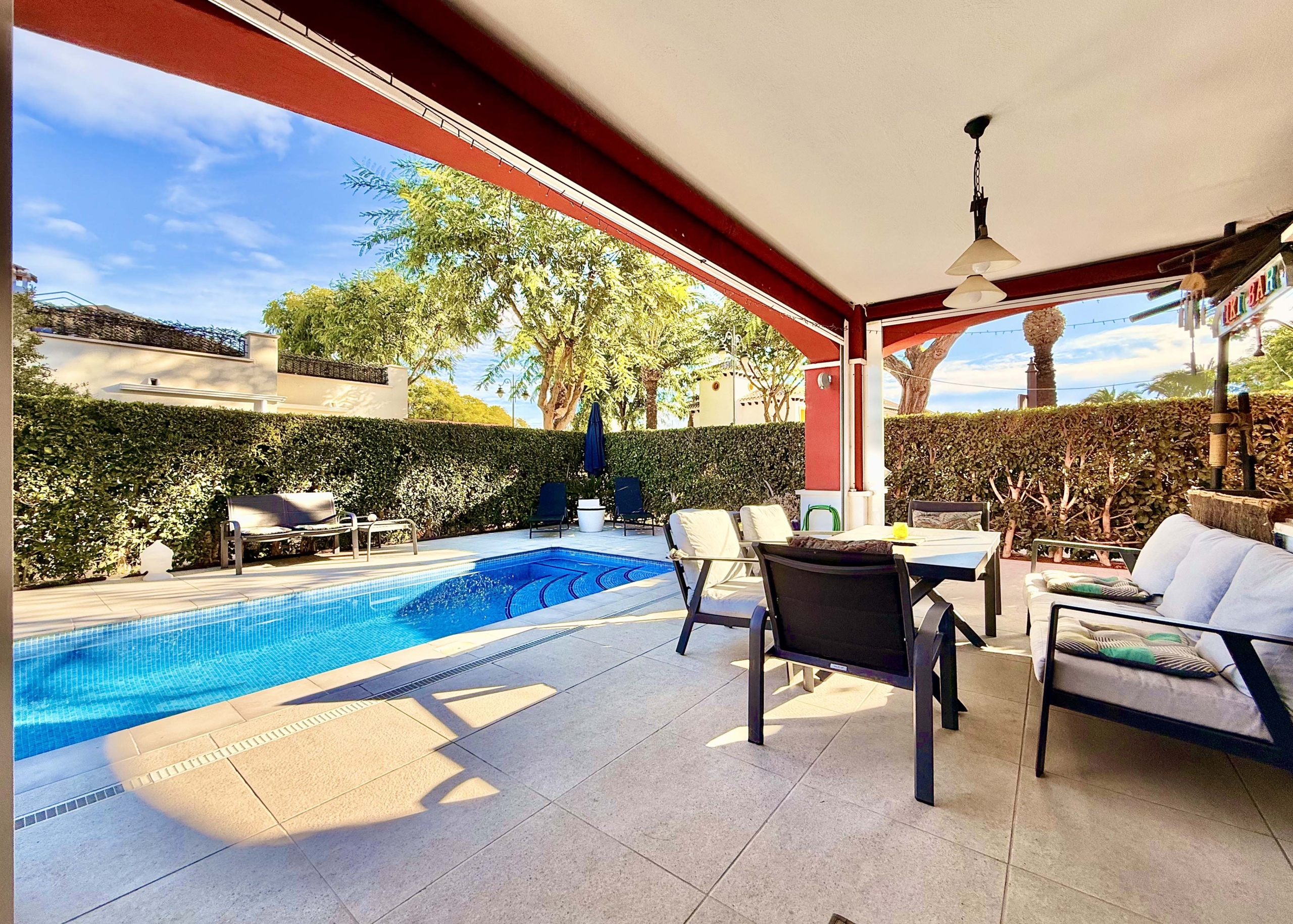 Rear covered terrace offering shaded afternoon space at the Isla Grosa villa on Mar Menor Golf Resort.