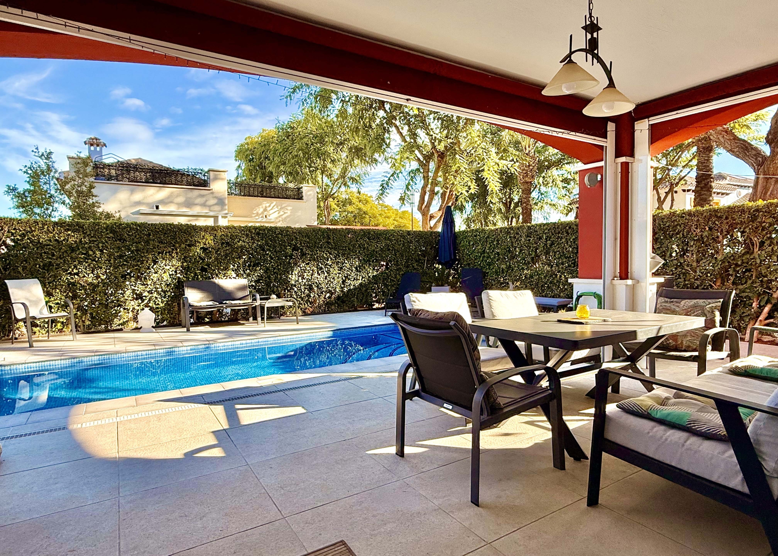 Rear covered terrace offering shaded afternoon space at the Isla Grosa villa on Mar Menor Golf Resort.