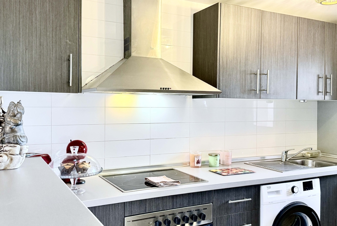 2-Bed Elegant Apartment modern kitchen with breakfast bar in a Levante Properties apartment at Mar Menor Golf Resort.