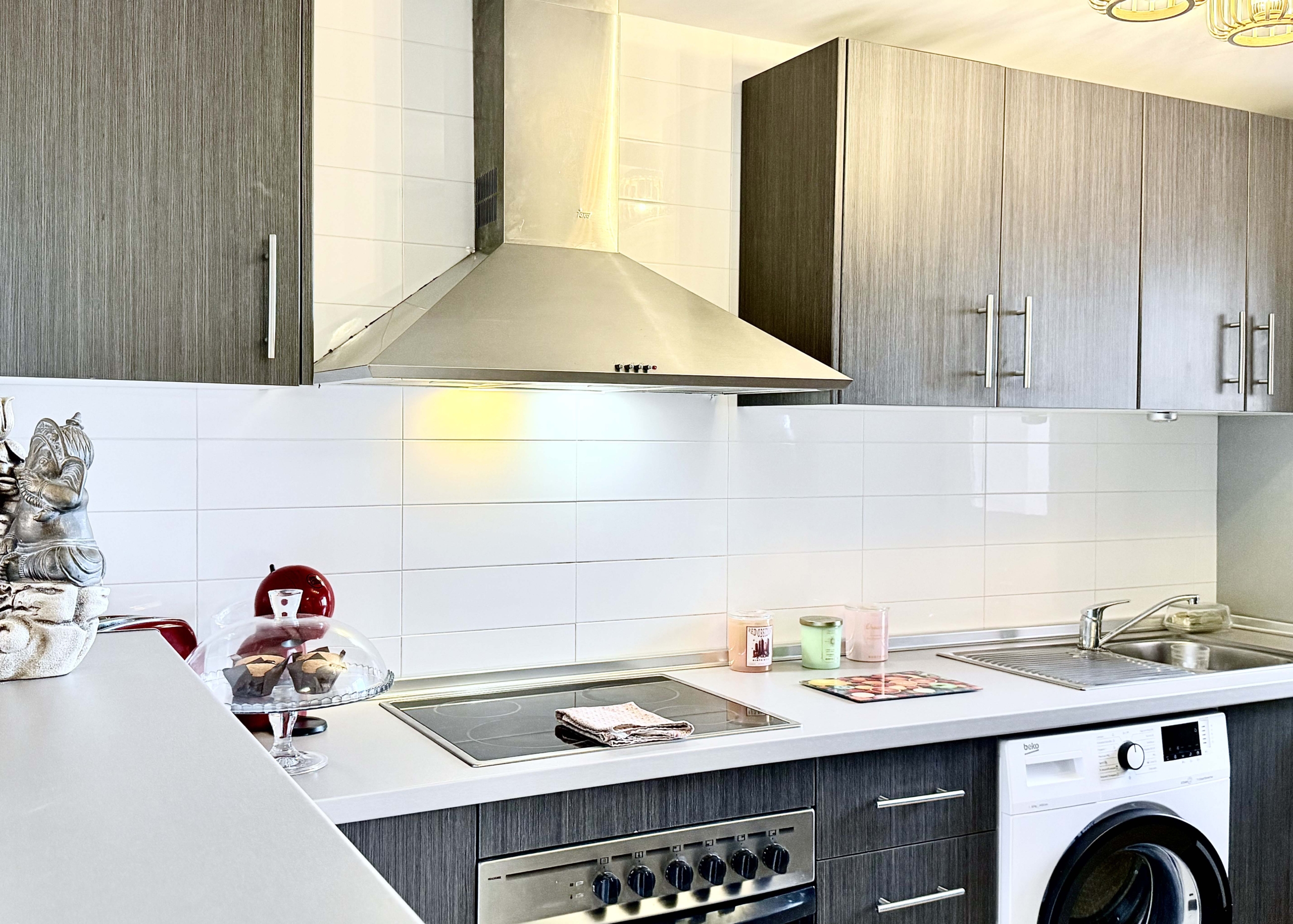 2-Bed Elegant Apartment modern kitchen with breakfast bar in a Levante Properties apartment at Mar Menor Golf Resort.