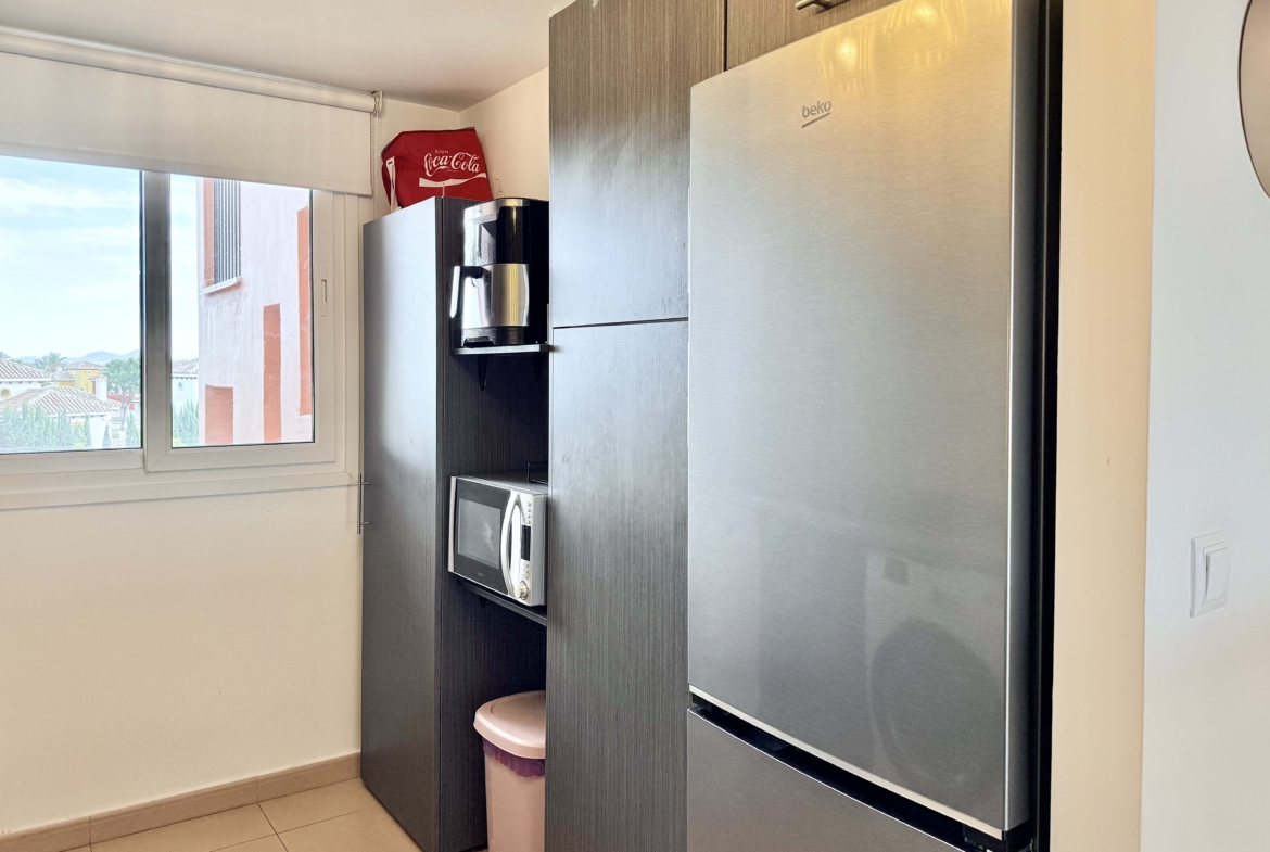 2-Bed Elegant Apartment modern kitchen with breakfast bar in a Levante Properties apartment at Mar Menor Golf Resort.