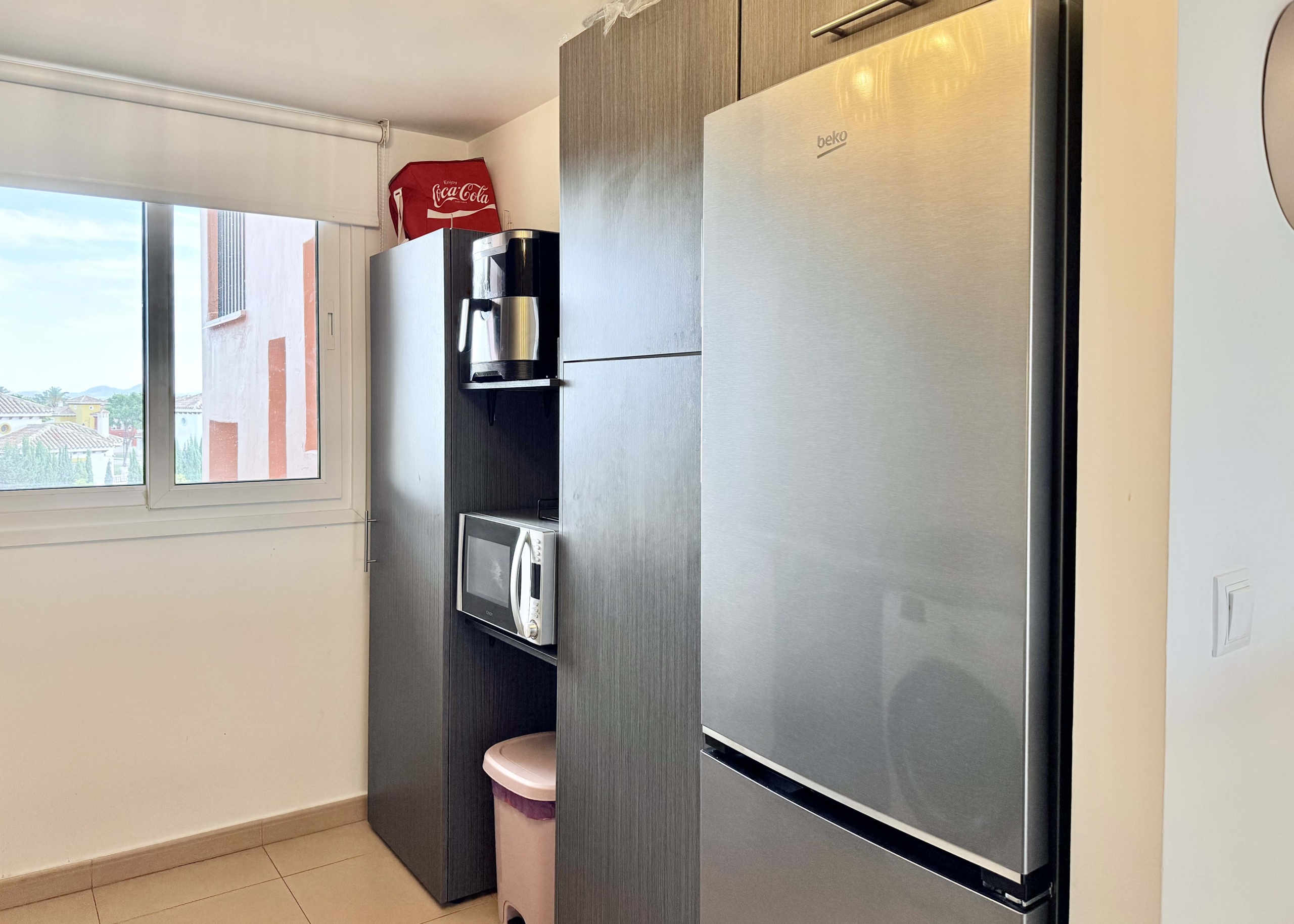 2-Bed Elegant Apartment modern kitchen with breakfast bar in a Levante Properties apartment at Mar Menor Golf Resort.
