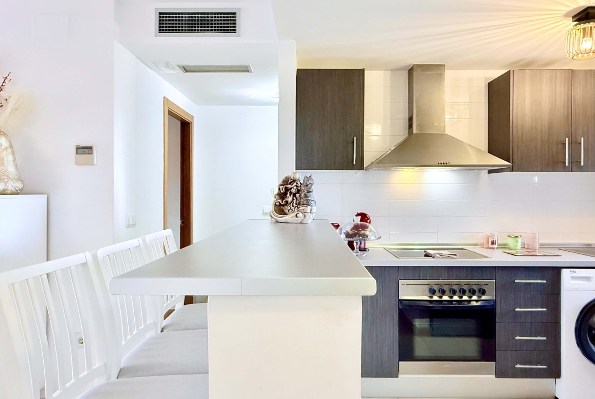 2-Bed Elegant Apartment modern kitchen with breakfast bar in a Levante Properties apartment at Mar Menor Golf Resort.