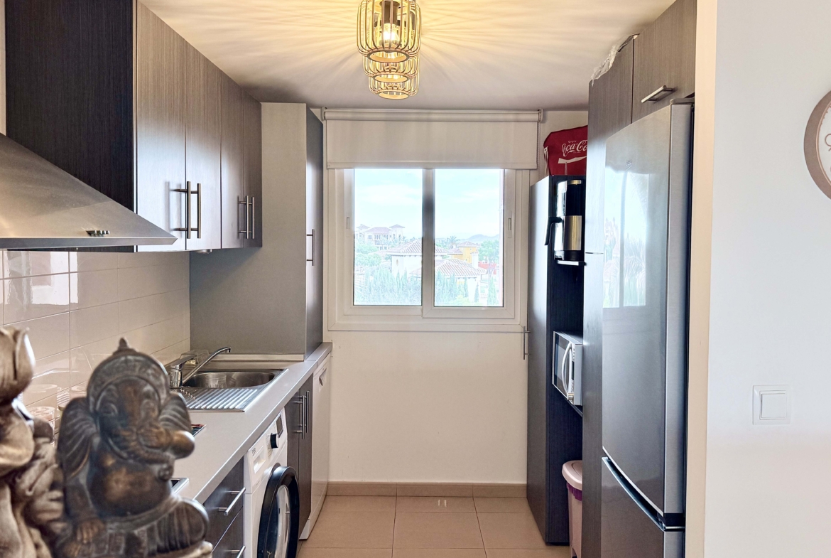 2-Bed Elegant Apartment modern kitchen with breakfast bar in a Levante Properties apartment at Mar Menor Golf Resort.