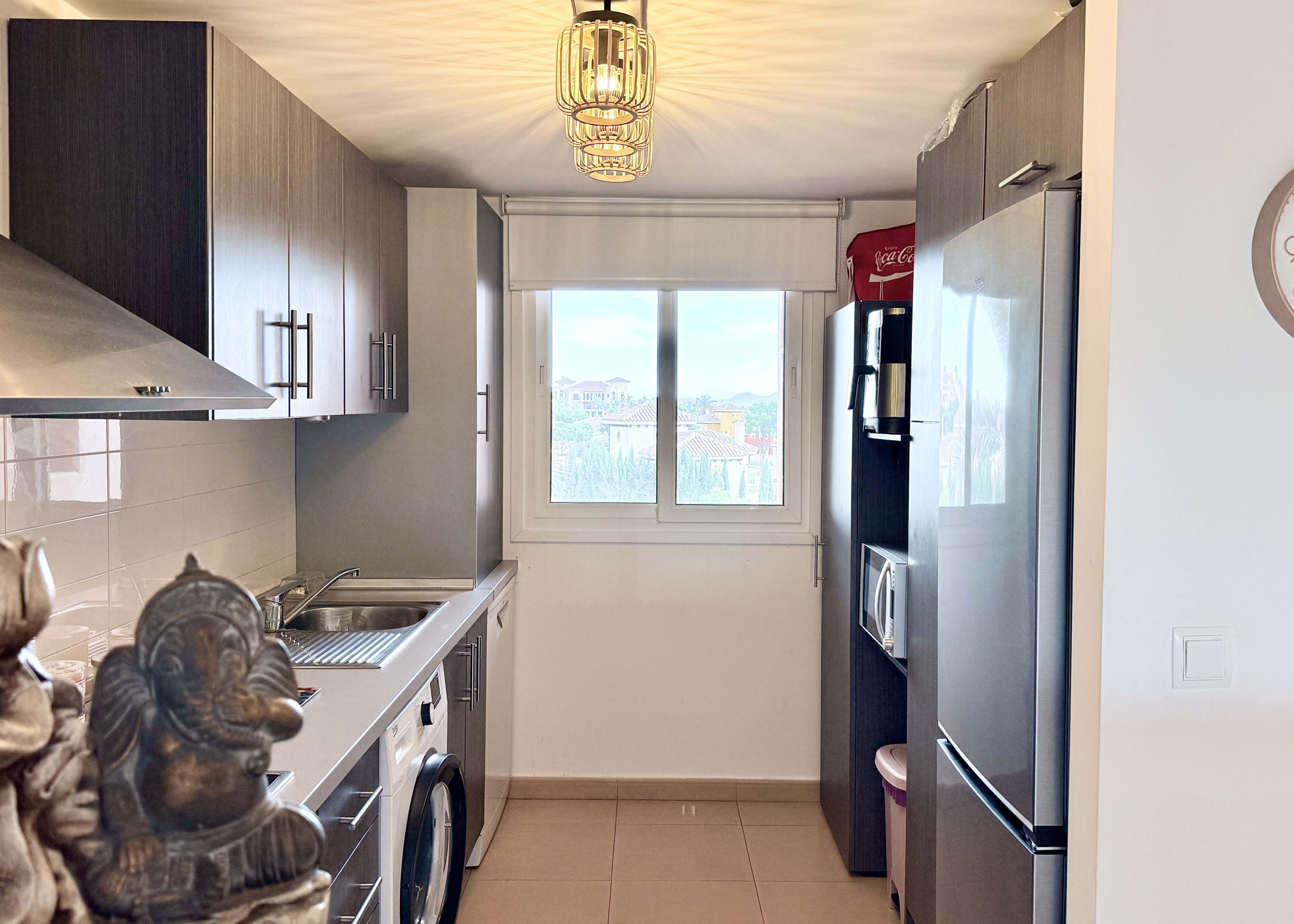 2-Bed Elegant Apartment modern kitchen with breakfast bar in a Levante Properties apartment at Mar Menor Golf Resort.