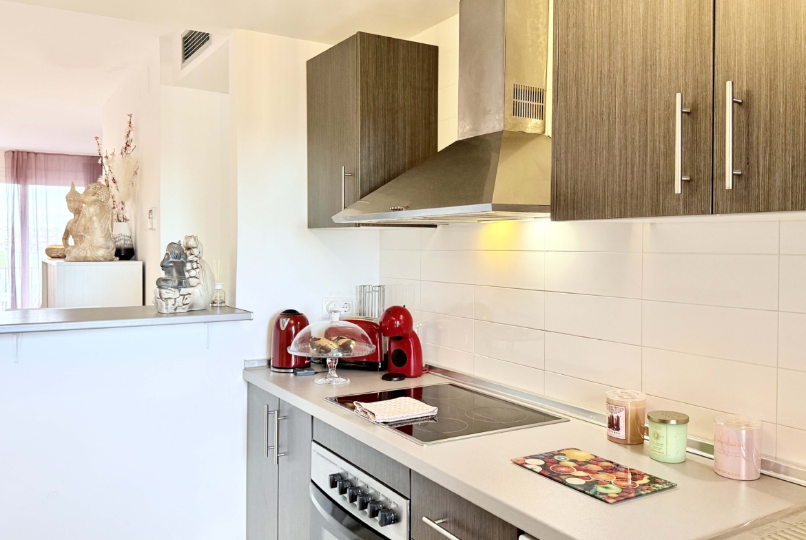 2-Bed Elegant Apartment modern kitchen with breakfast bar in a Levante Properties apartment at Mar Menor Golf Resort.
