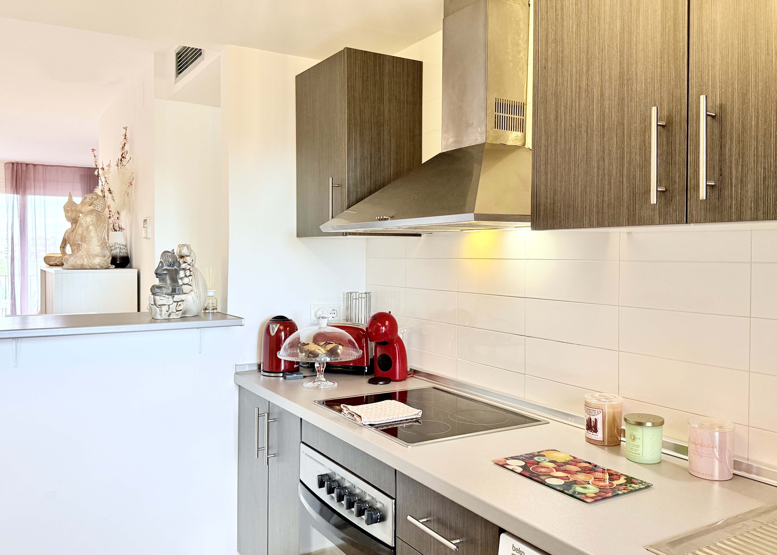2-Bed Elegant Apartment modern kitchen with breakfast bar in a Levante Properties apartment at Mar Menor Golf Resort.