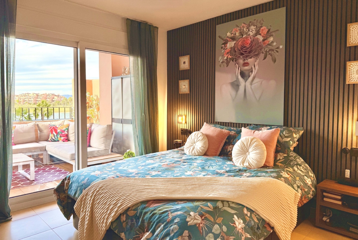 2-Bed Elegant Apartment master bedroom with terrace access and lake views at Mar Menor Golf Resort, offered by Levante Properties.