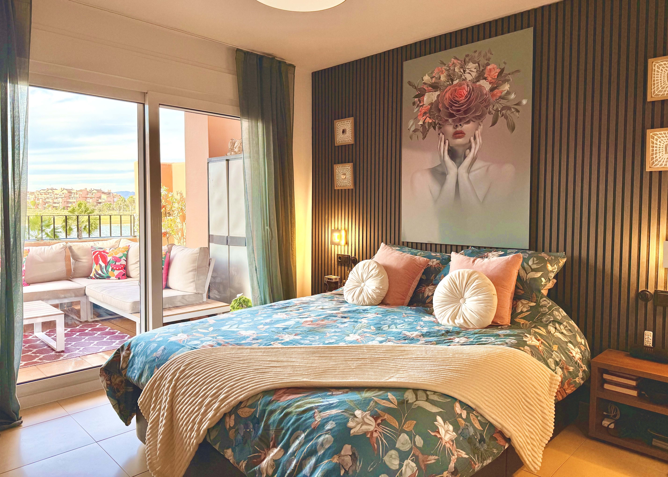 2-Bed Elegant Apartment master bedroom with terrace access and lake views at Mar Menor Golf Resort, offered by Levante Properties.